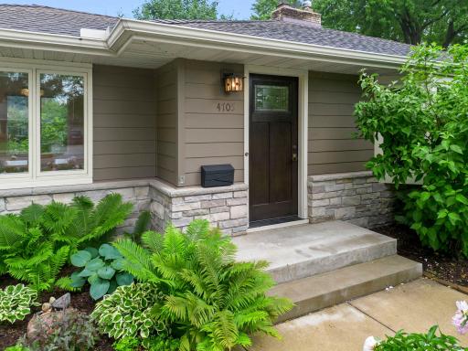 The front steps were replaced when the concrete driveway was installed. Close up view of the newer stone.