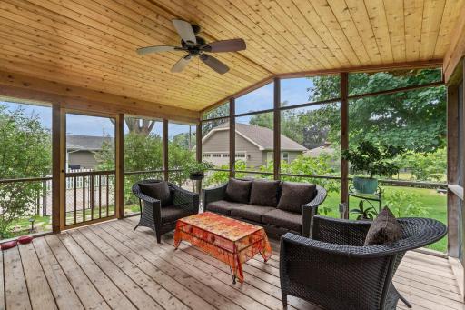 The screen porch is a short distance from the garage.