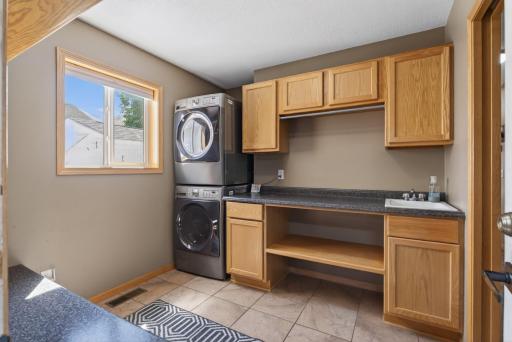Main floor laundry - storage and folding center with