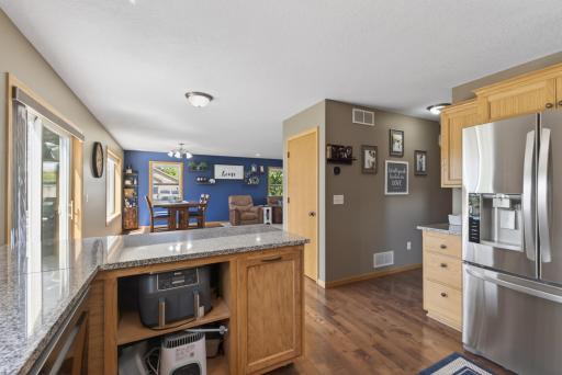 A movable kitchen peninsula on industrial casters easily converts to a flexible island for added functionality.