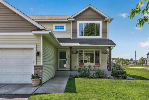 The concrete apron seamlessly extends into the front sidewalk leading to the home.