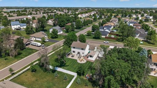 Outdoor living at its best with an entertainment and grill center set within a fully landscaped, sidewalk-connected neighborhood.