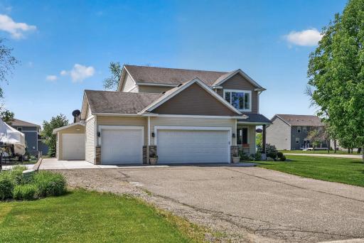 Three-stall garage, additional parking, and a 20' x 10' shed provide exceptional storage and functionality inside and out.