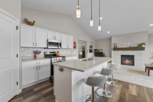 Quartz countertops throughout the property with kitchen center island w/ upgraded electrical outlets for convenience.