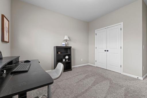Spacious room with paneled double doors.