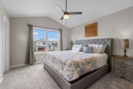 Owner's Suite with new ceiling fan and window treatments.