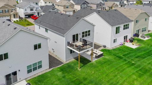 Exterior view of property shows the vinyl siding, new deck, concrete patio, architectural shingles, and maintenance free windows. Plus- maintenance free hardi-board trim
