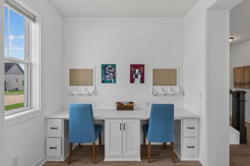 A thoughtfully designed built-in study nook offers the perfect place for homework, creative projects, or working from home, with dual stations, generous storage, and an ideal location just off the living room.