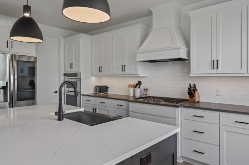 Where style meets function--this exceptional culinary space offers generous storage, gas cooking, a spacious island, and timeless finishes throughout.