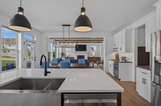 A seamless layout keeps everyone connected, with generous prep space, a beverage station, and inviting gathering areas just steps away.