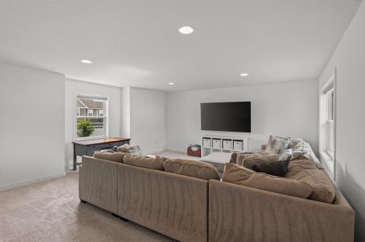 The expansive upper level amusement room is the ultimate entertainment area. Designed for everyday enjoyment, this generous bonus space creates the perfect setting for movie nights, game days, or simply unwinding at the end of the day.
