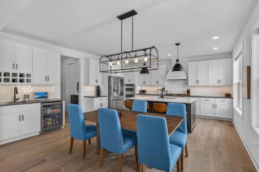 Host with ease in this inviting dining area, where designer lighting, generous proportions, and an open layout that creates an atmosphere that's welcoming, functional, and ready for every occasion.