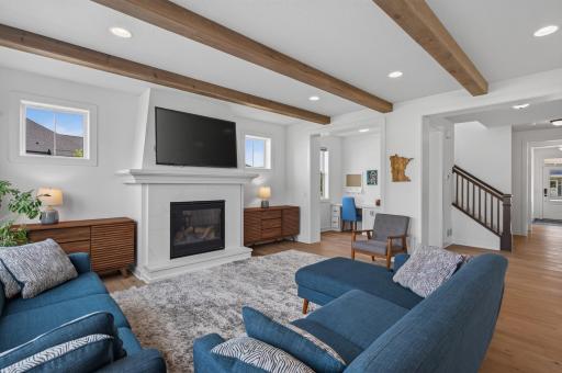 This alternate view of the living room looks toward the dedicated study area in the background.