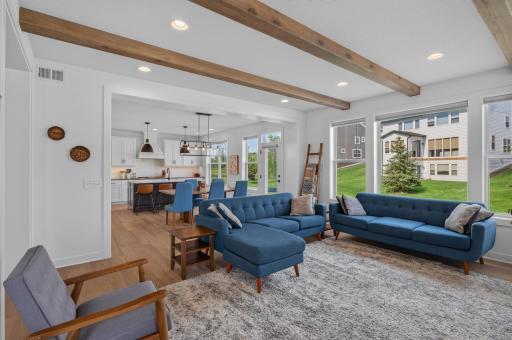 Walls of windows and an airy, connected layout create a bright, inviting atmosphere where everyday life flows effortlessly from one space to the next, making it easy to host, relax, and enjoy every season.