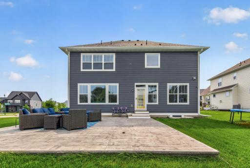 Enjoy effortless indoor-outdoor living with a sprawling stamped concrete patio designed for conversation, cookouts, and evening get-togethers.