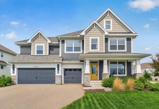 Welcome home to timeless curb appeal, where classic architecture, a charming covered front porch, and a striking three car garage create an unforgettable first impression.