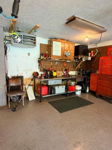 Note the gas garage heater. Metal work bench will not stay.