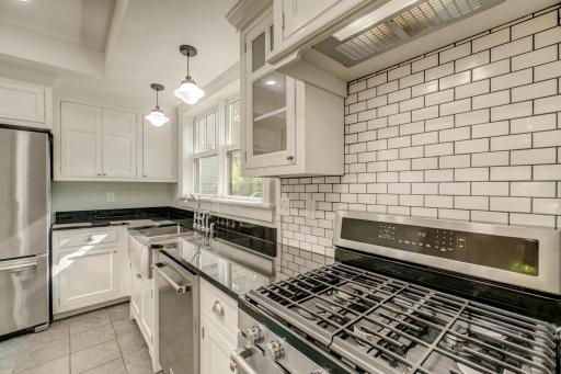 All stainless appliances and gleaming subway tile.