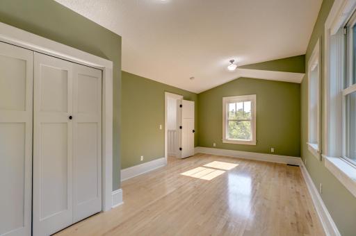 This second bedroom on the south end of the home floods with light on a sunny day.