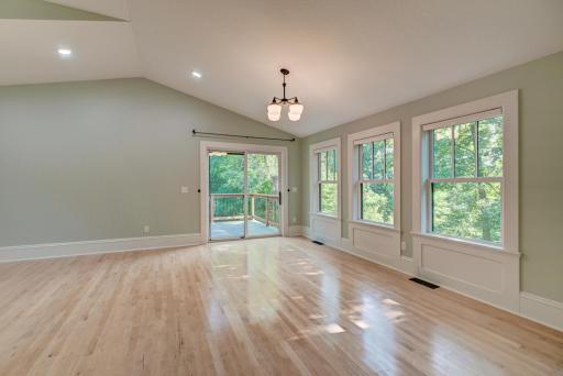 A bedroom fit for royalty! Note the custom finish of the panel molding beneath each window.