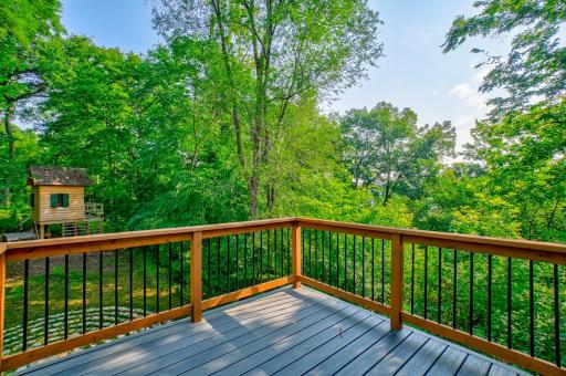 The home is in a woodsy, private setting. In less leafy months, you can see the river from this deck and from many of the upper level windows on the east side of the home.