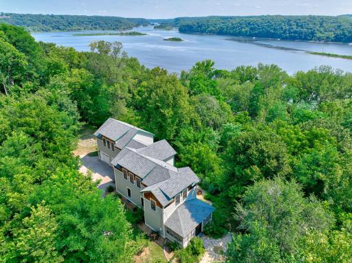 Tucked in the woods, with the river close by. The new Lumberjack Landing park is just down the hill, giving you direct access to the river.