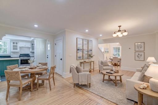 This shot is virtually staged to suggest one way to arrange the main floor, with informal kitchen table off the kitchen, living room in the middle, and a more formal dining room in the front room.