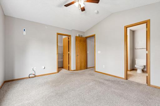 Spacious primary bedroom with en suite bathroom.