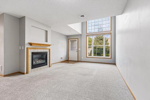Fireplace with amazing natural light! New glass has been ordered for the upper window.