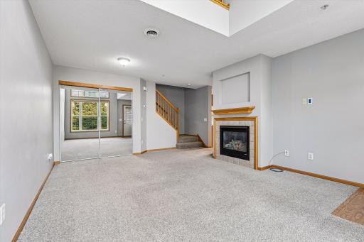Spacious living room with fireplace.