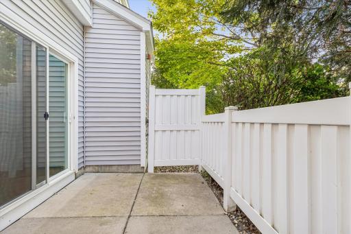 This charming patio just off the kitchen is a wonderful place to enjoy your morning coffee surrounded by greenery!