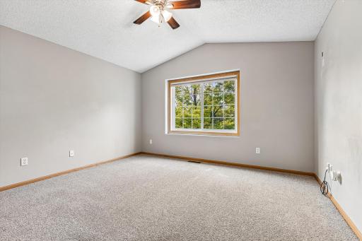 Large windows create a bright and airy atmosphere.