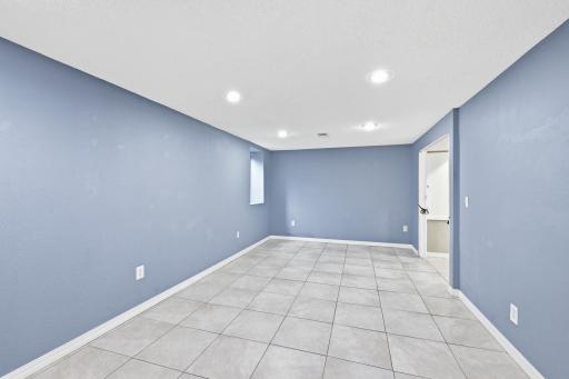 The lower-level family room provides excellent versatility and could easily be converted into a fourth bedroom, supported by an egress window and a convenient 3/4 bathroom on that floor.