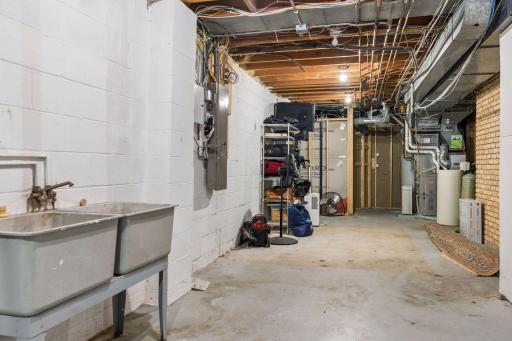 Ample lower level unfinished storage room and utilities.