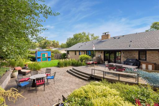 Incredible backyard with giant deck and paver patio. Natural gas lines are plumbed to both the grill and the firepit.