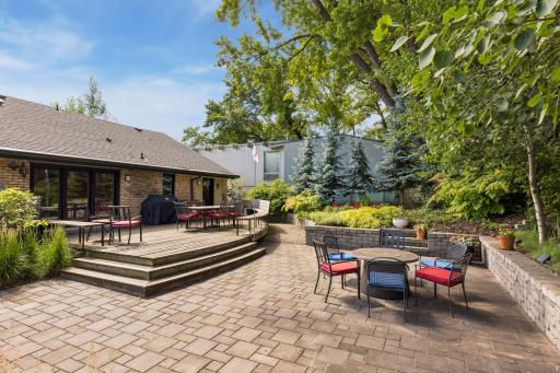 Incredible backyard with giant deck and paver patio. Natural gas lines are plumbed to both the grill and the firepit.