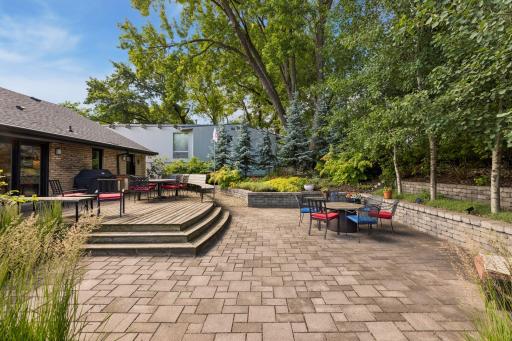 Incredible backyard with giant deck and paver patio. Natural gas lines are plumbed to both the grill and the firepit.
