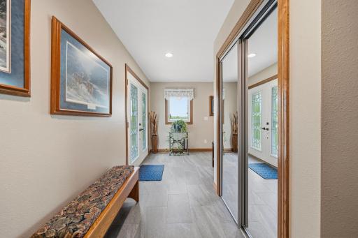 Foyer with ceramic tile and garage entrance
