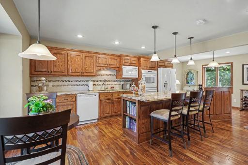 Beautiful granite countertops and cabinets with pull-out drawers for easy storage.