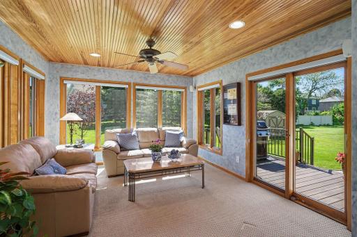 Four season porch opens to deck and backyard.