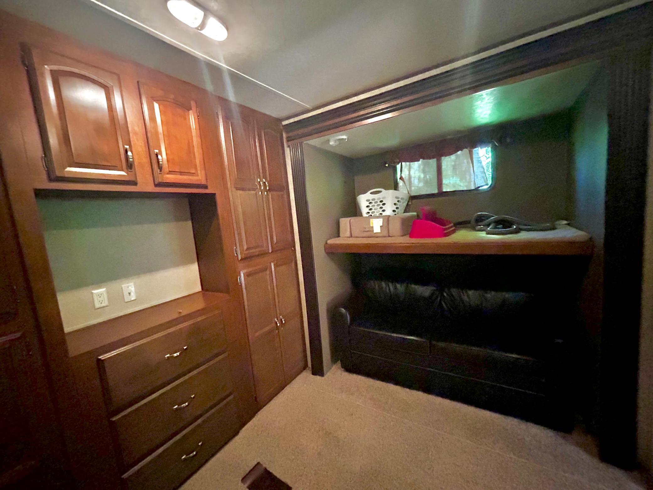 Camper One - Primary bedroom with a couch that pulls out into a sleeper.