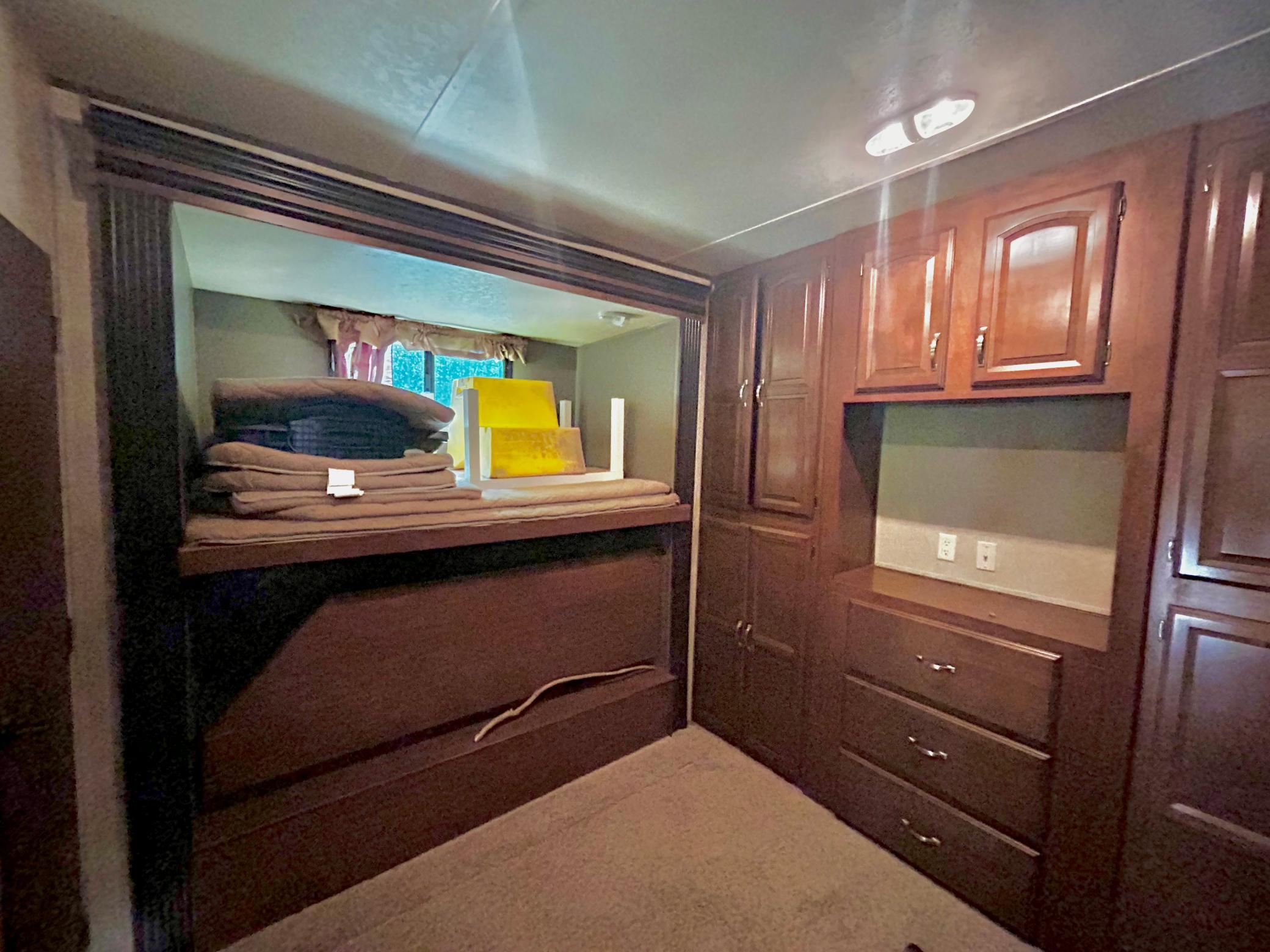 Camper One - Primary bedroom with plenty of storage, TV hook up and sleeping area