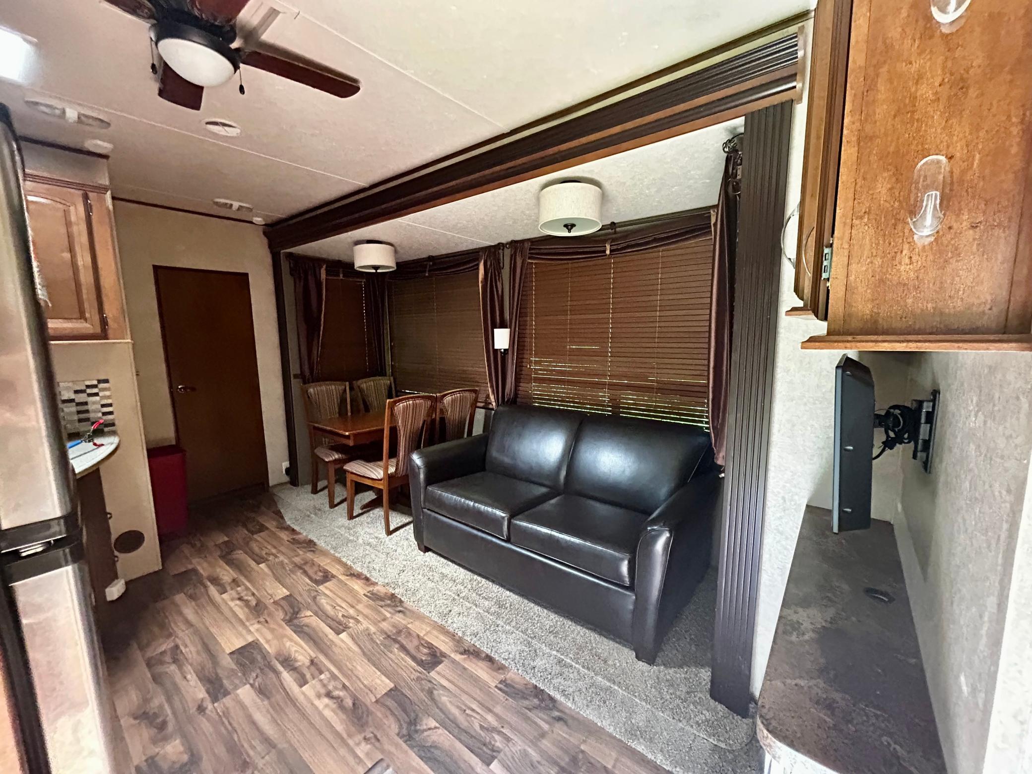 Inside Camper One, the kitchen table and all furniture will be sold with the property