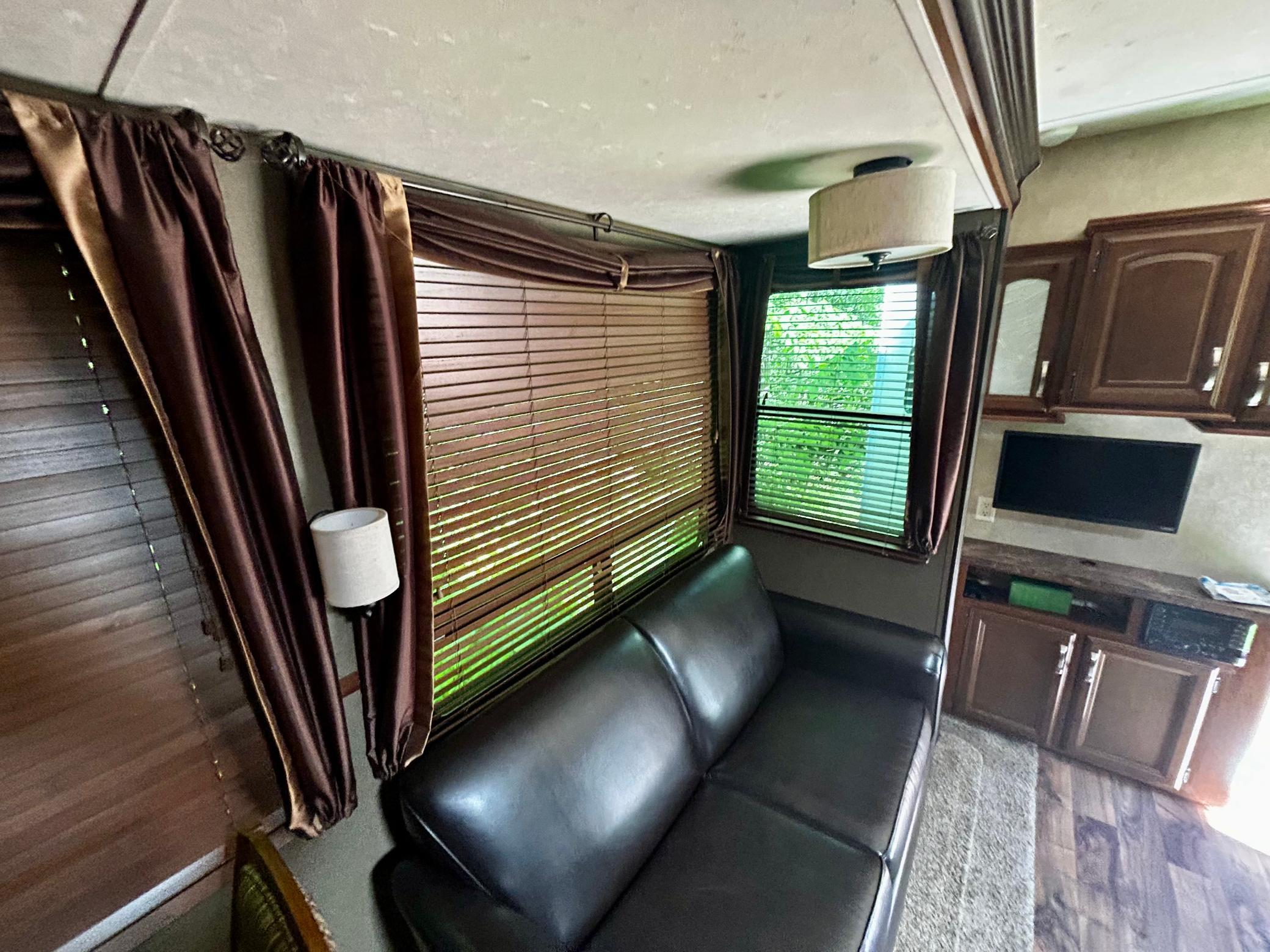 Camper One - Living area with TV hook-up and a pull-out couch. A perfect space to chill if the weather outside doesn't cooperate