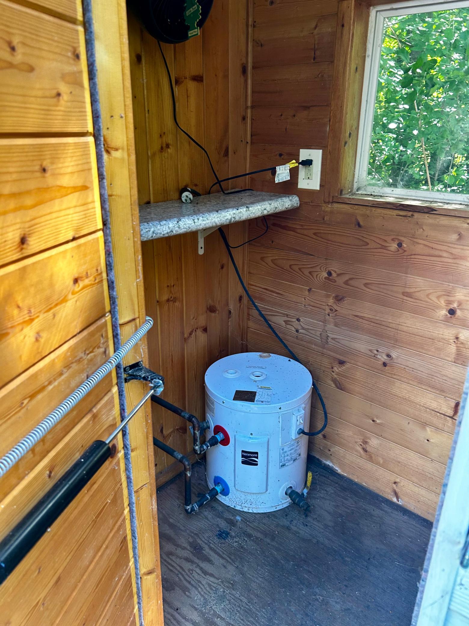 Outhouses - Outhouse next to the shower, with a water heater supplying the shower