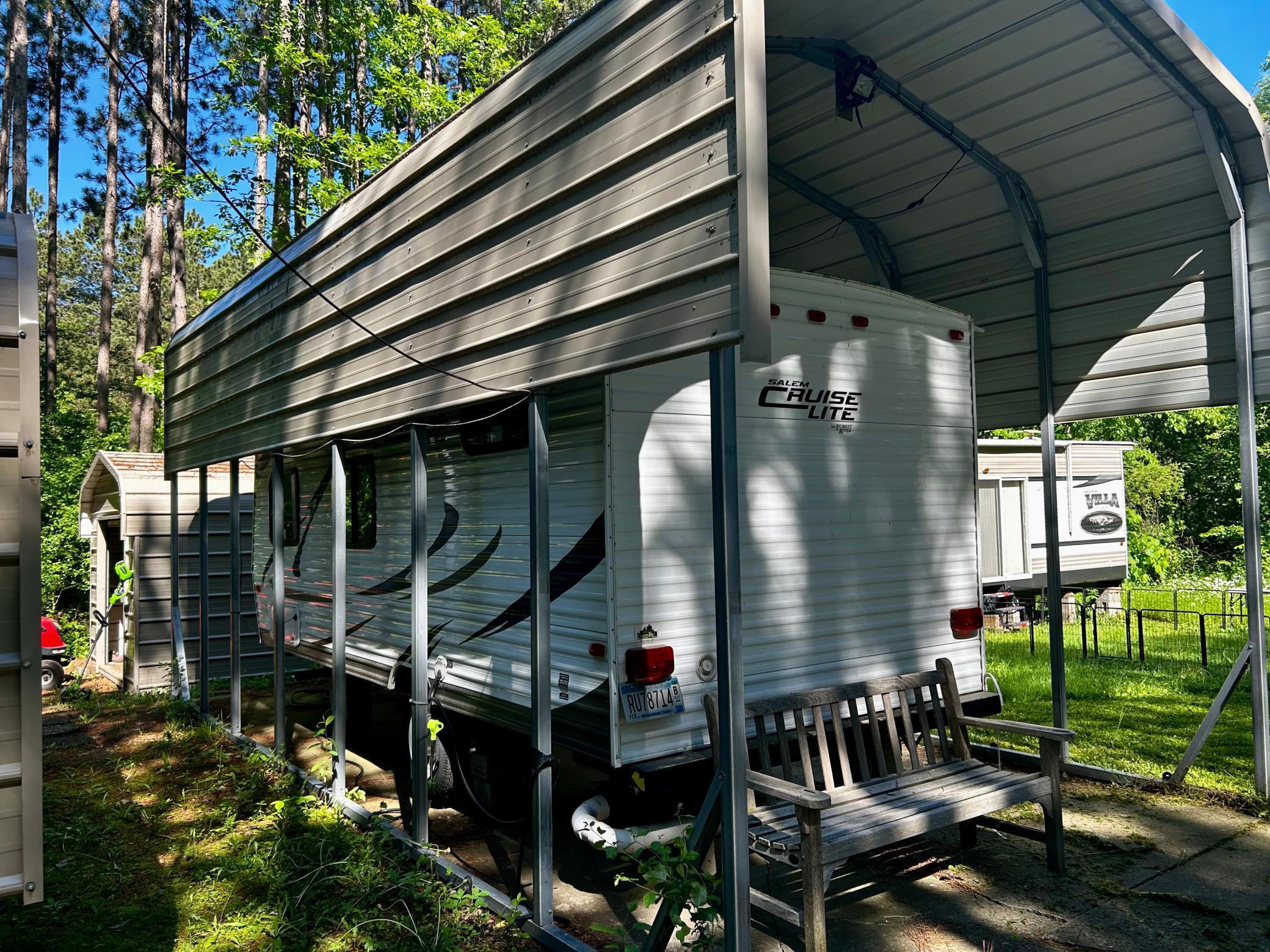 Camper Two - Under a protective awning to keep it out of the elements