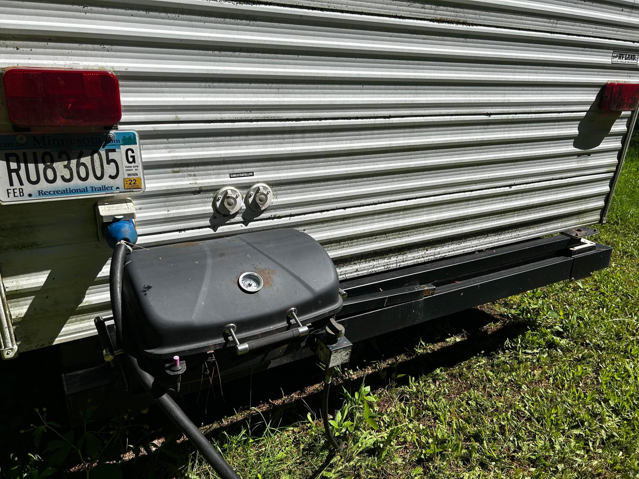 Gas grill attached to the camper one, no need to transport one from home