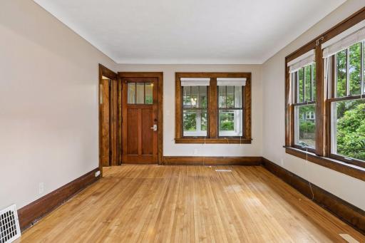 Natural woodwork and hardwood floors throughout