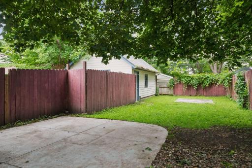 Another patio area in the yard which is fully fenced