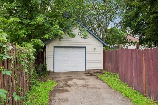 Extra sized one car garage also has a heater inside for working inside